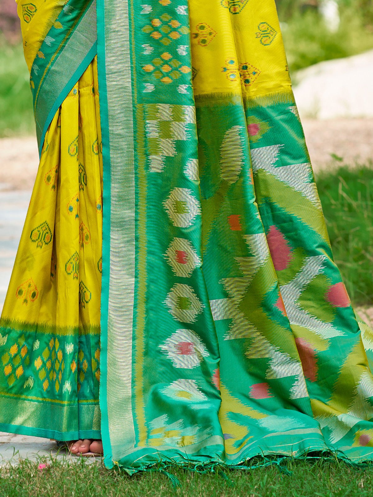 Yellow silk printed saree with contrast border and blouse
