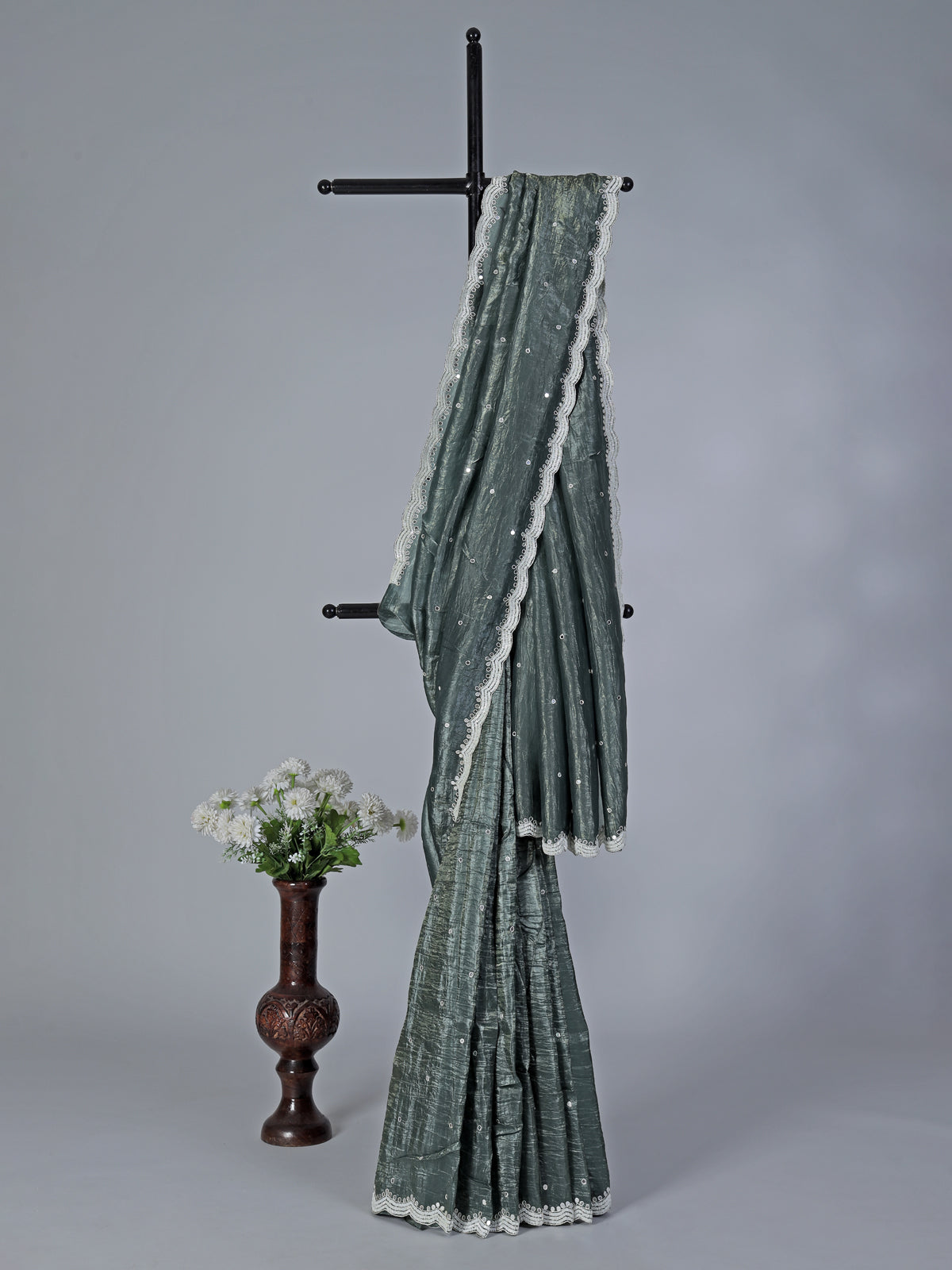 Rama green tissue silk saree with elegant embellishments