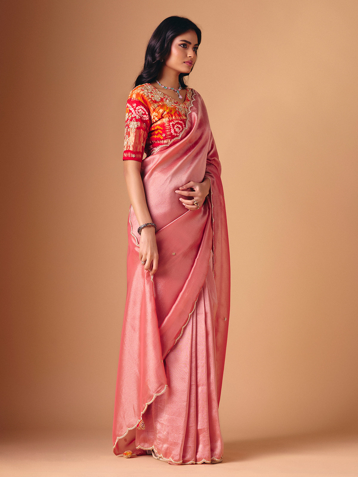 Peach tissue silk embellished saree