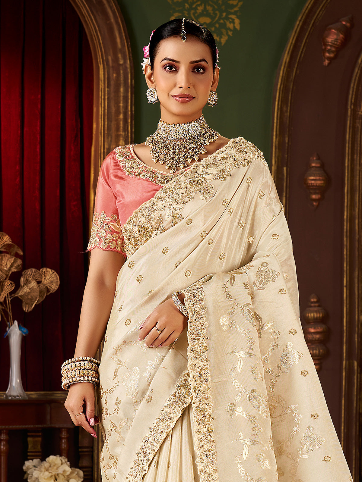 Cream soft silk embroidered saree with contrast blouse