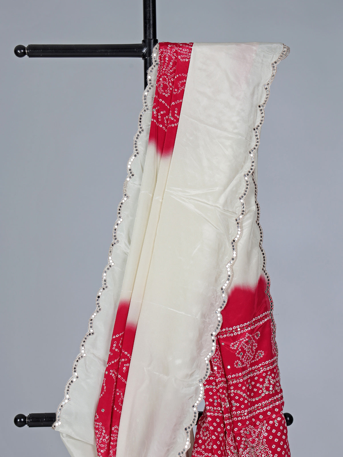 Cream red bandhej printed festive wear saree