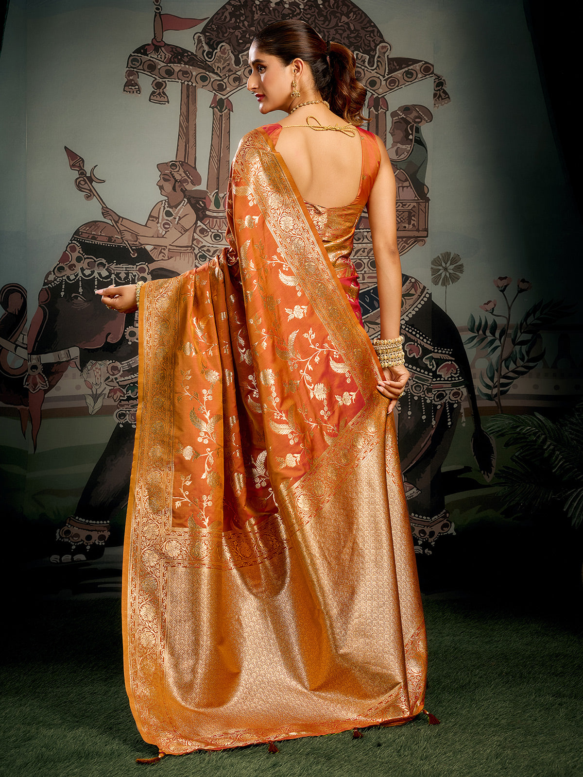 Orange zari worked silk saree for festival