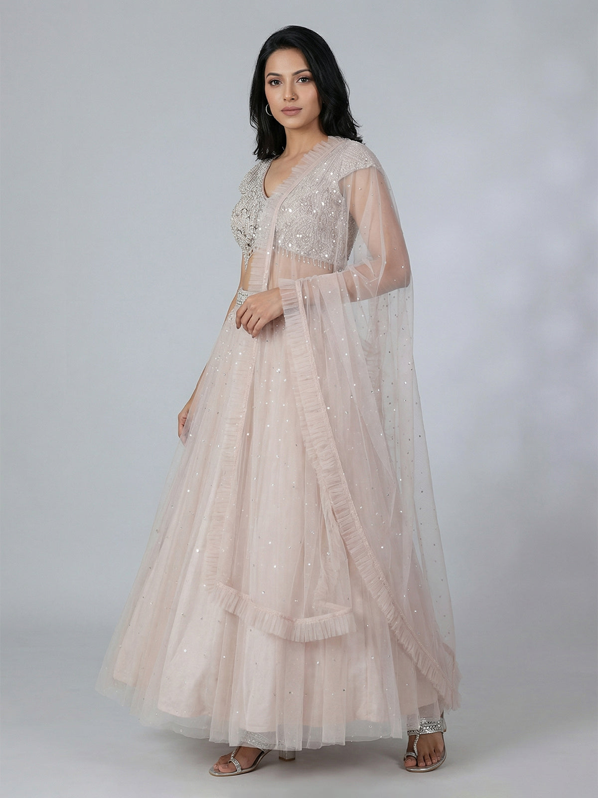 Beige net mirror embellished lehenga choli with dupatta