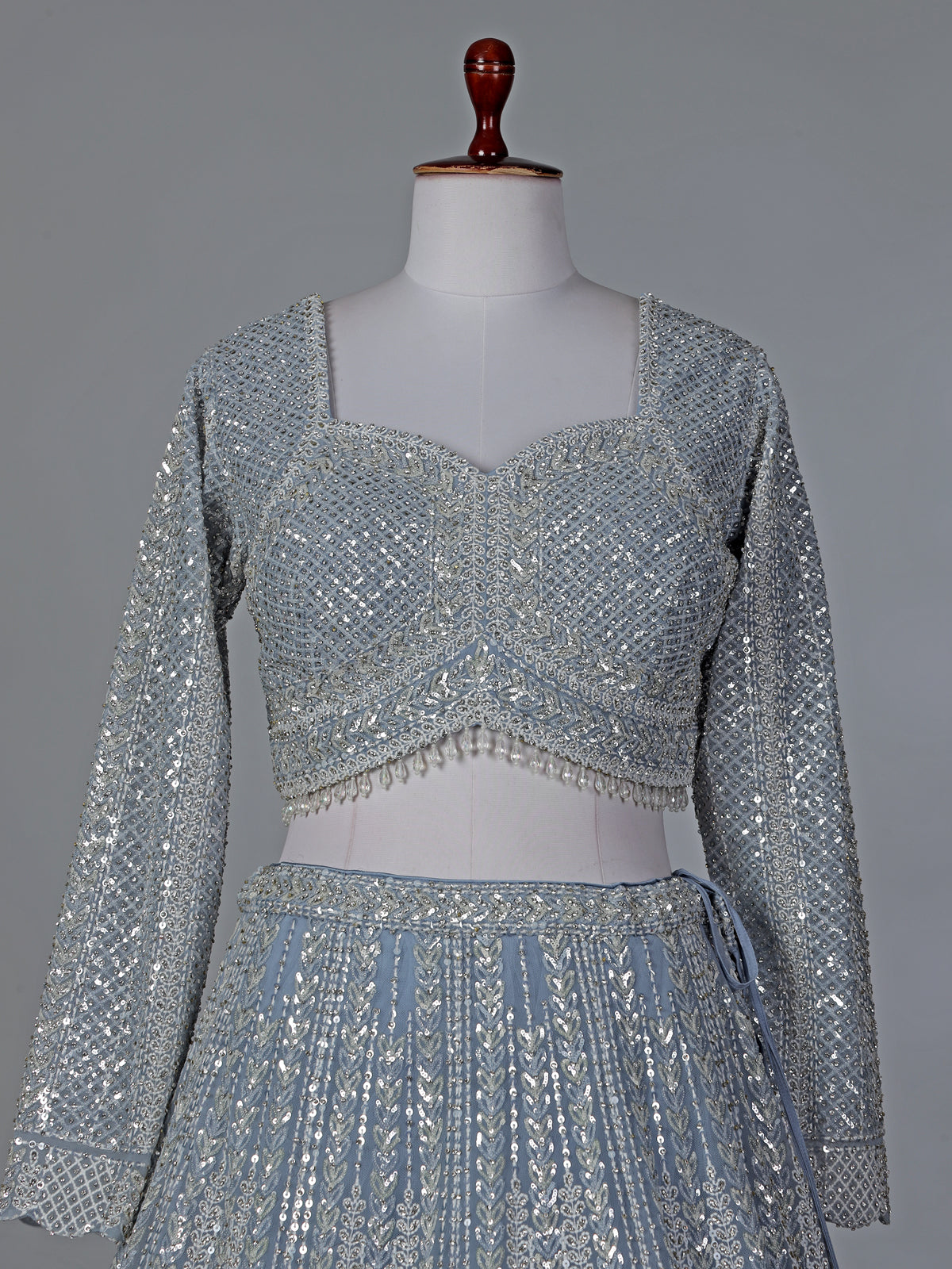 Grey wedding wear net lehenga choli with sequins detailing