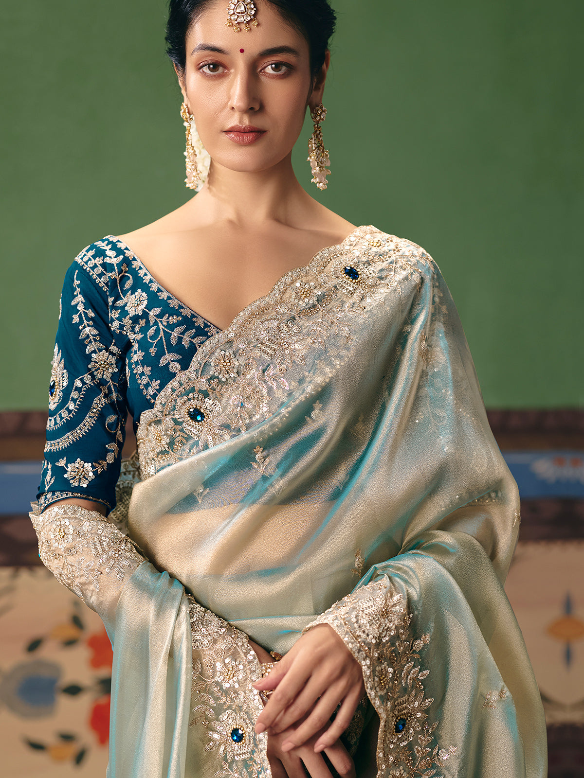 Mint blue fancy silk saree with rich embellishments