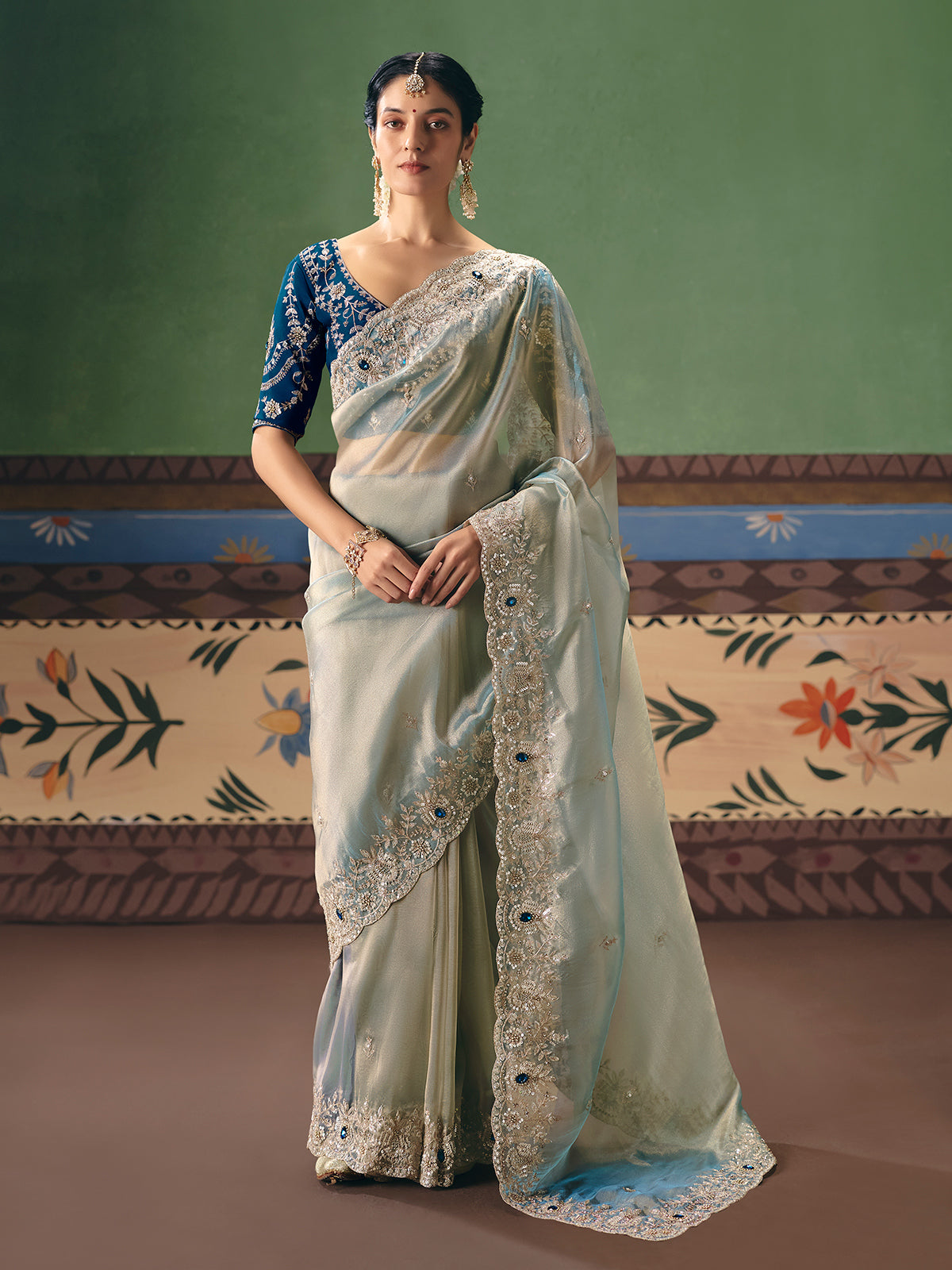 Mint blue fancy silk saree with rich embellishments