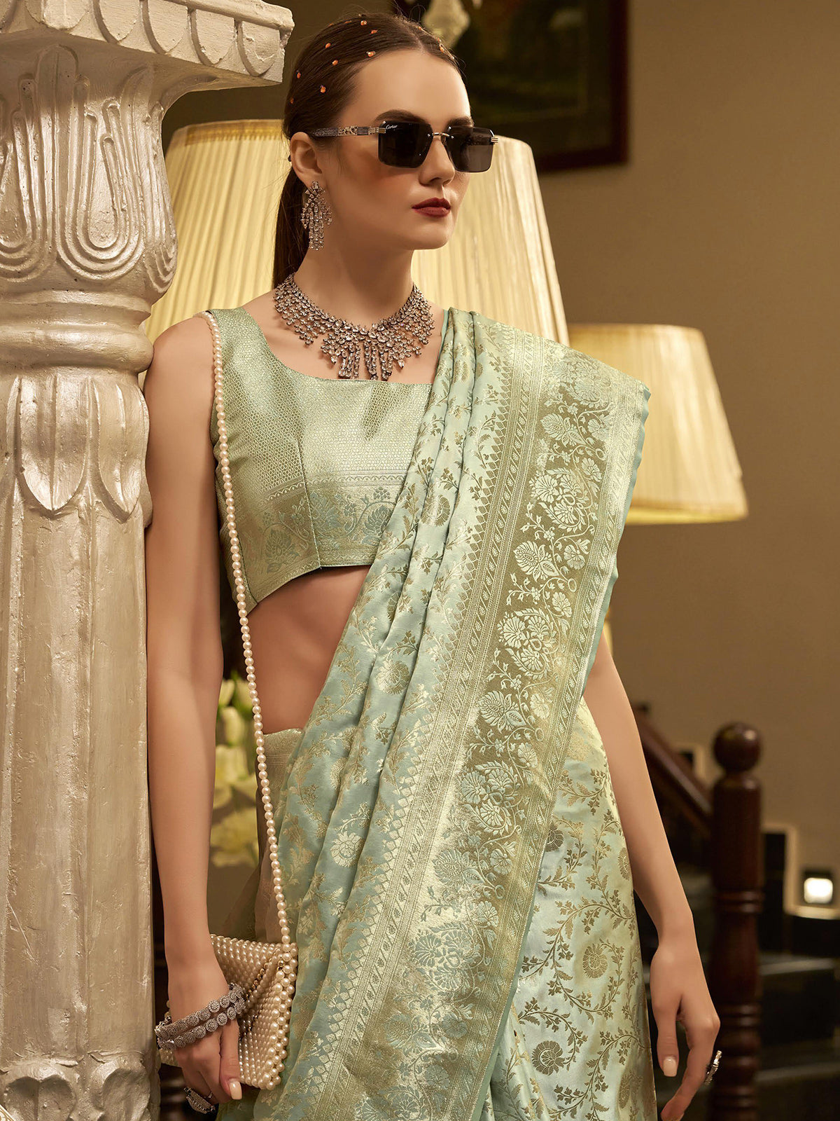 Pista green satin silk saree with zari detailing