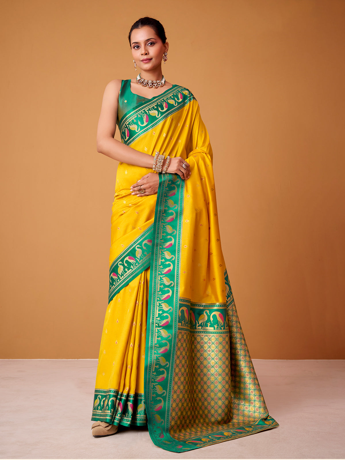 Yellow satin silk saree with bold rama green border