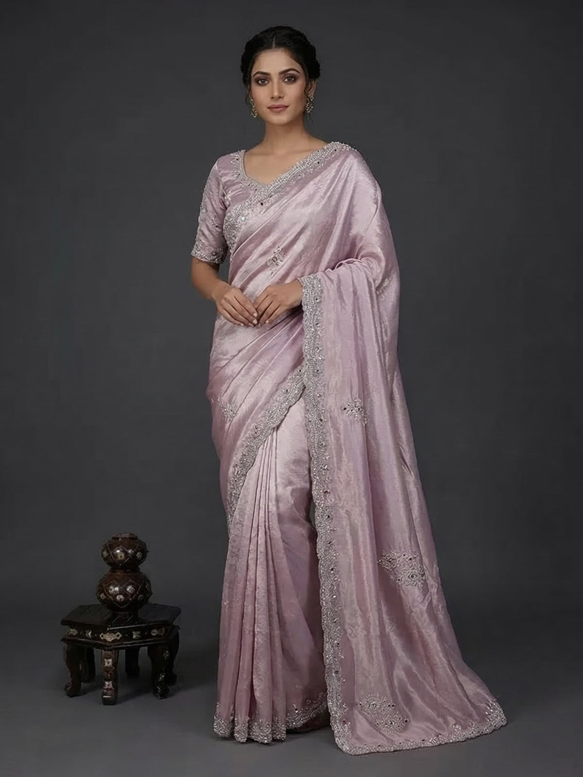 Pastel purple tissue silk saree with stone embellishments