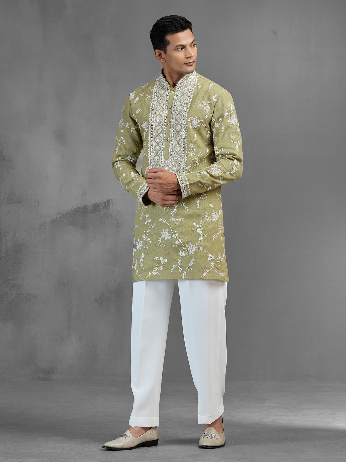 Green linen heritage aari crafted festive kurta suit