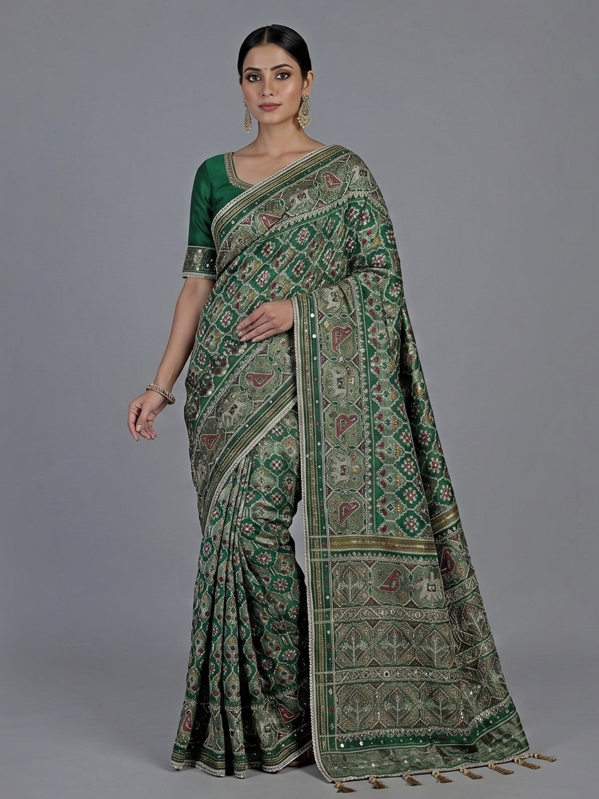 Green art patola silk saree with sequins and zardosi accents