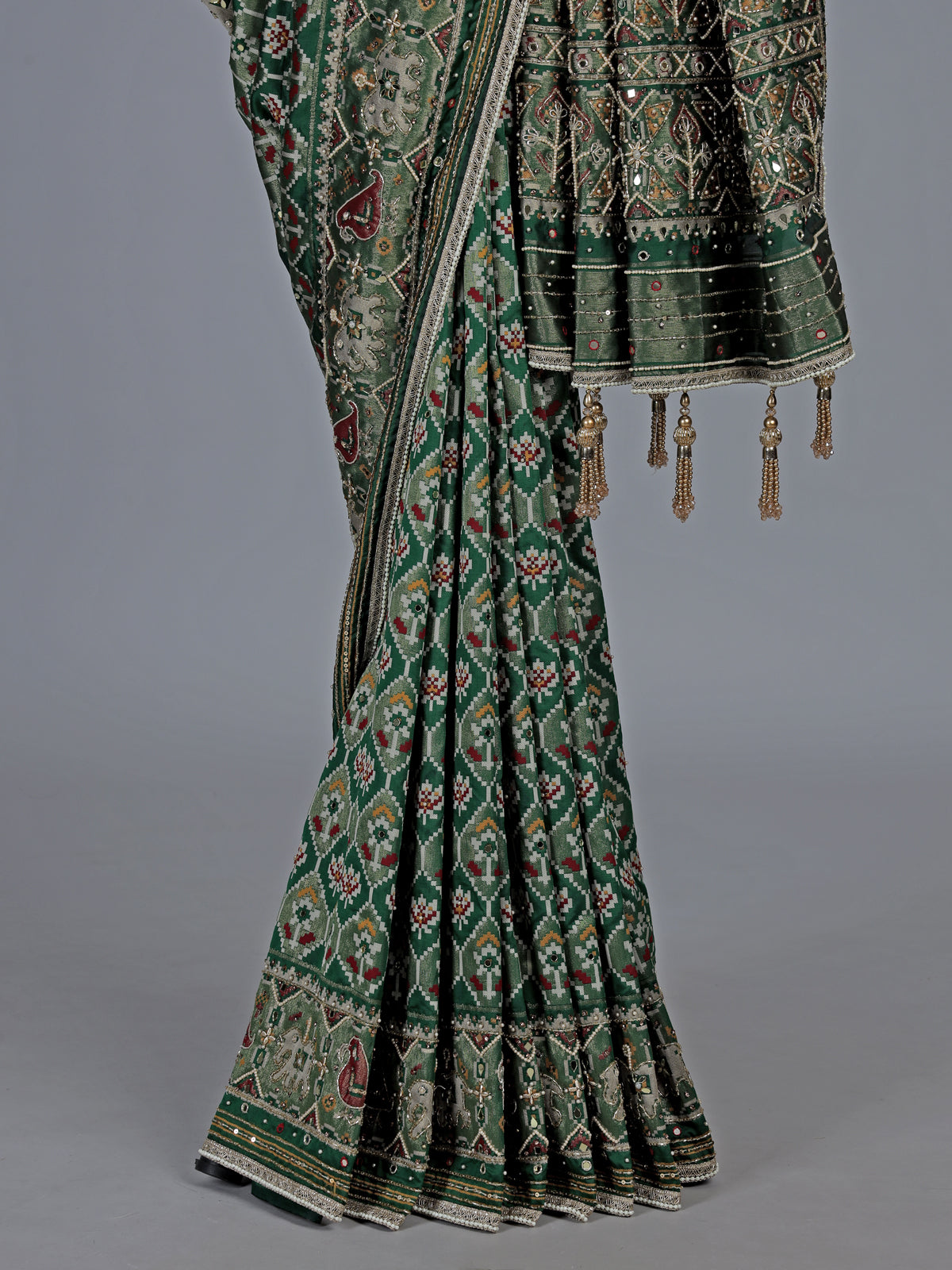 Green art patola silk saree with sequins and zardosi accents