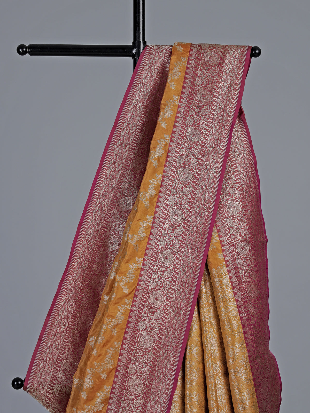Mustard yellow banarasi silk saree with magenta zari border