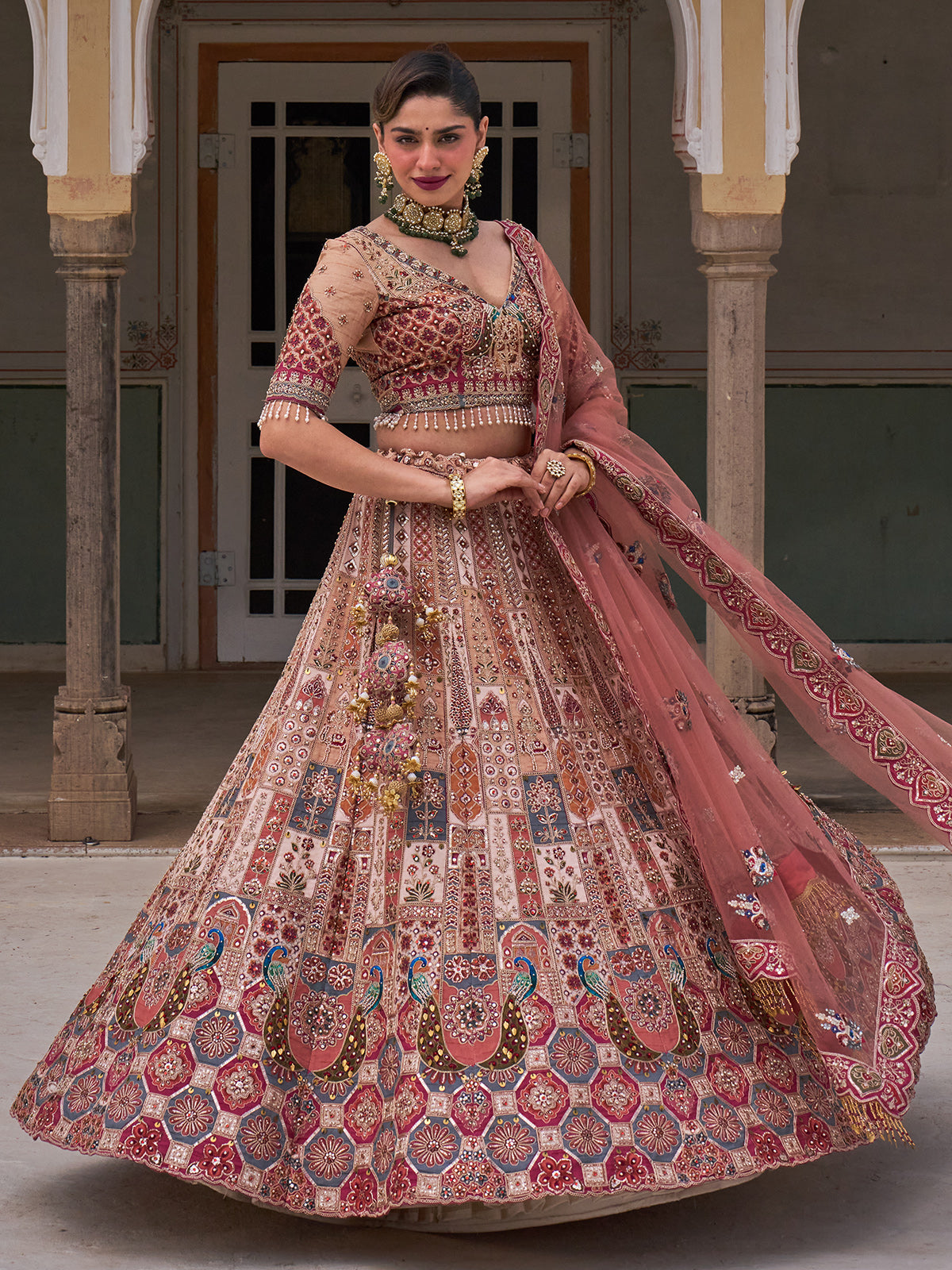 Cream silk net designer lehenga choli with multicolor resham work