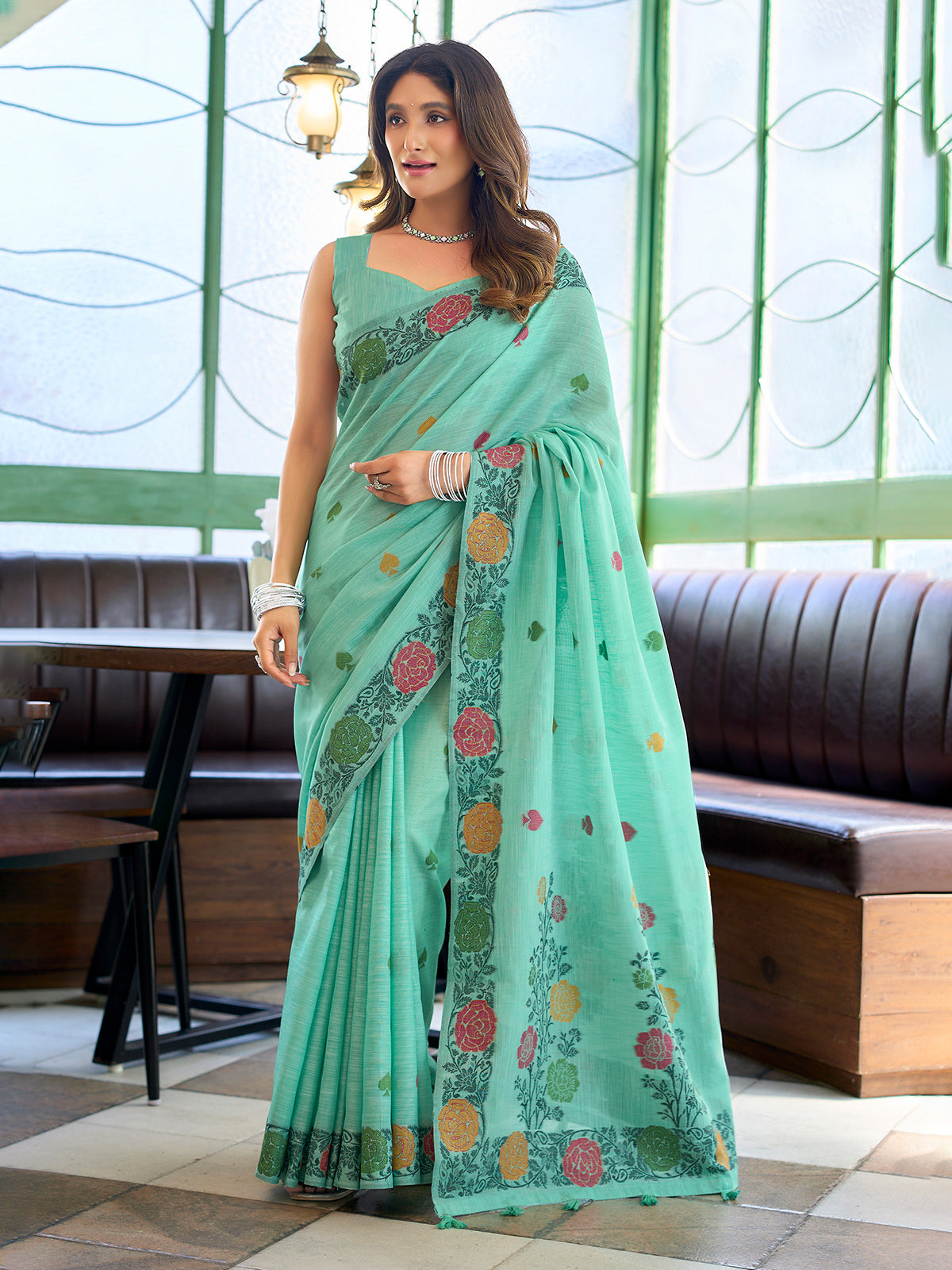 Sophisticated seafoam green cotton linen saree with floral design