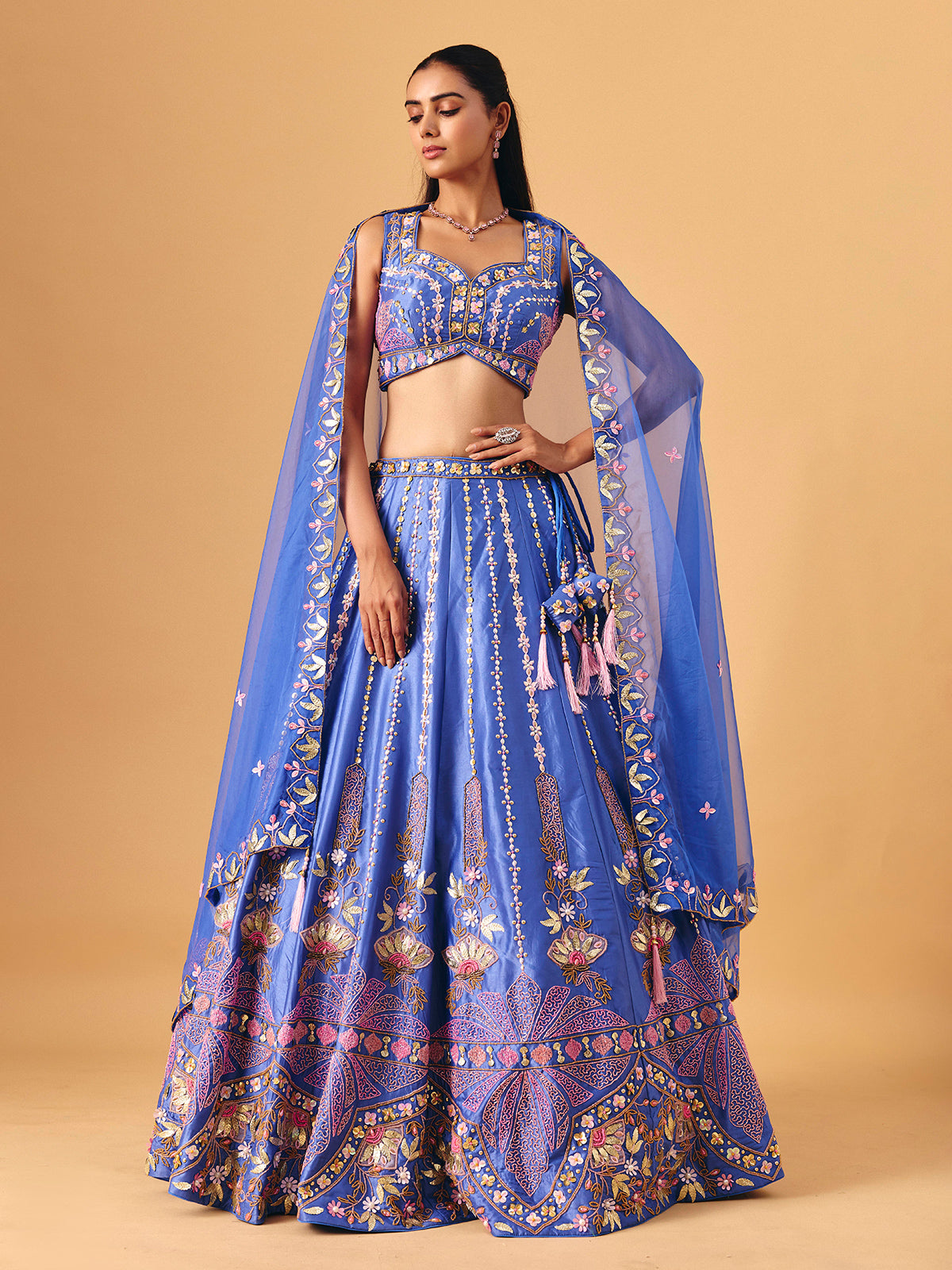 Royal blue silk lehenga choli with pearl embellished artistry