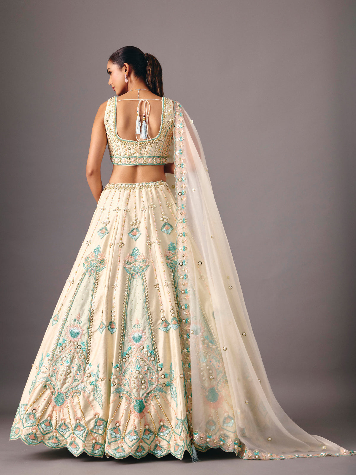 Cream silk lehenga choli with pearl and thread detailing