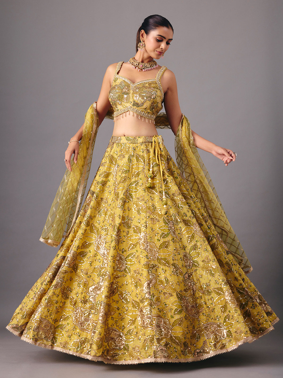 Mehendi yellow georgette silk lehenga choli with embellishments
