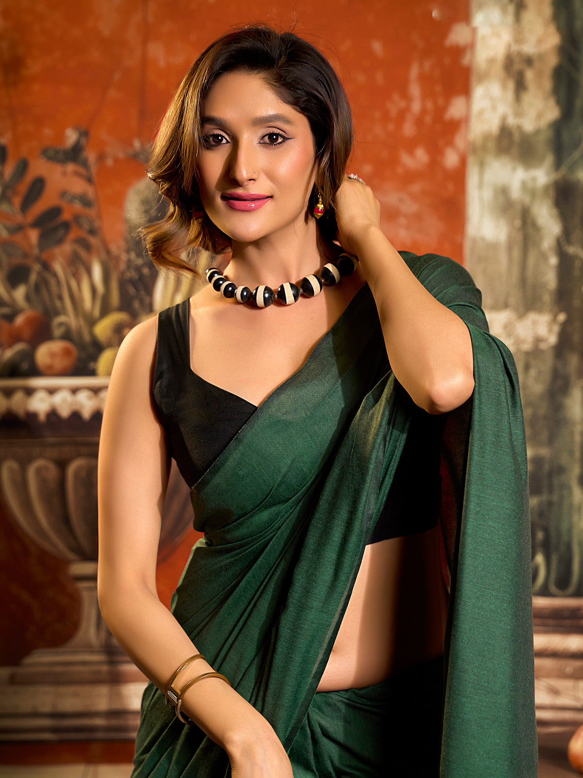 Green cotton saree with elegant tassel pallu design