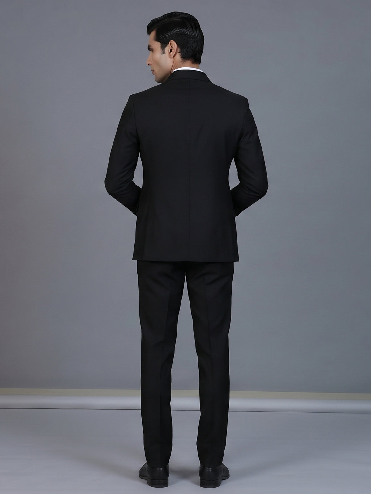 Classic black formal double breasted suit with bold peak lapel