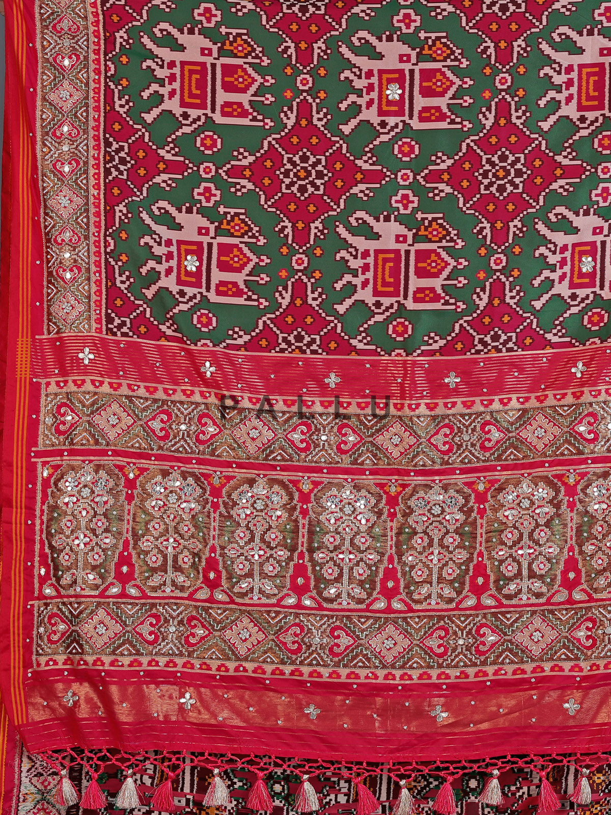 Green art patola silk saree with elephant motif detailing