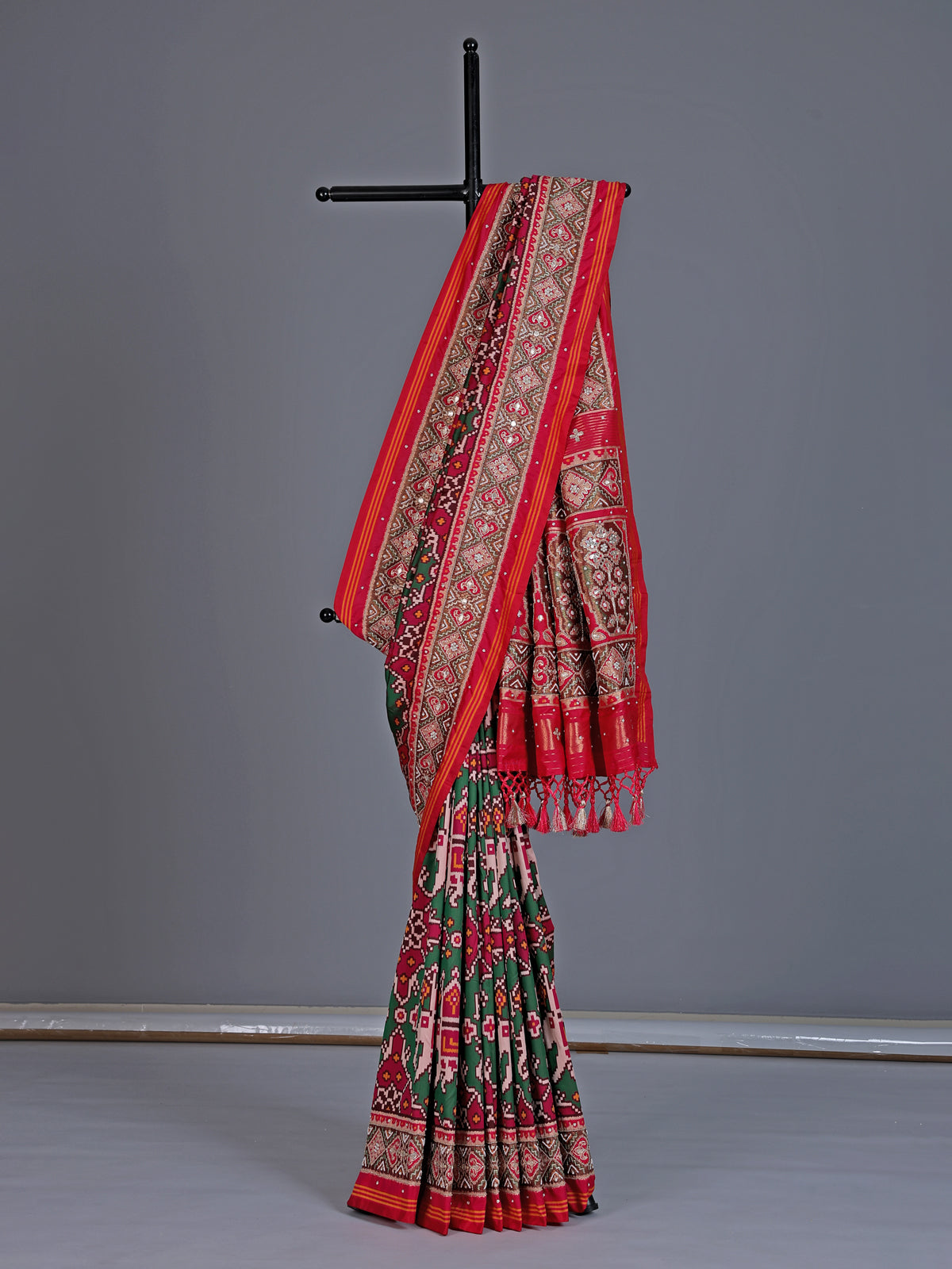 Green art patola silk saree with elephant motif detailing