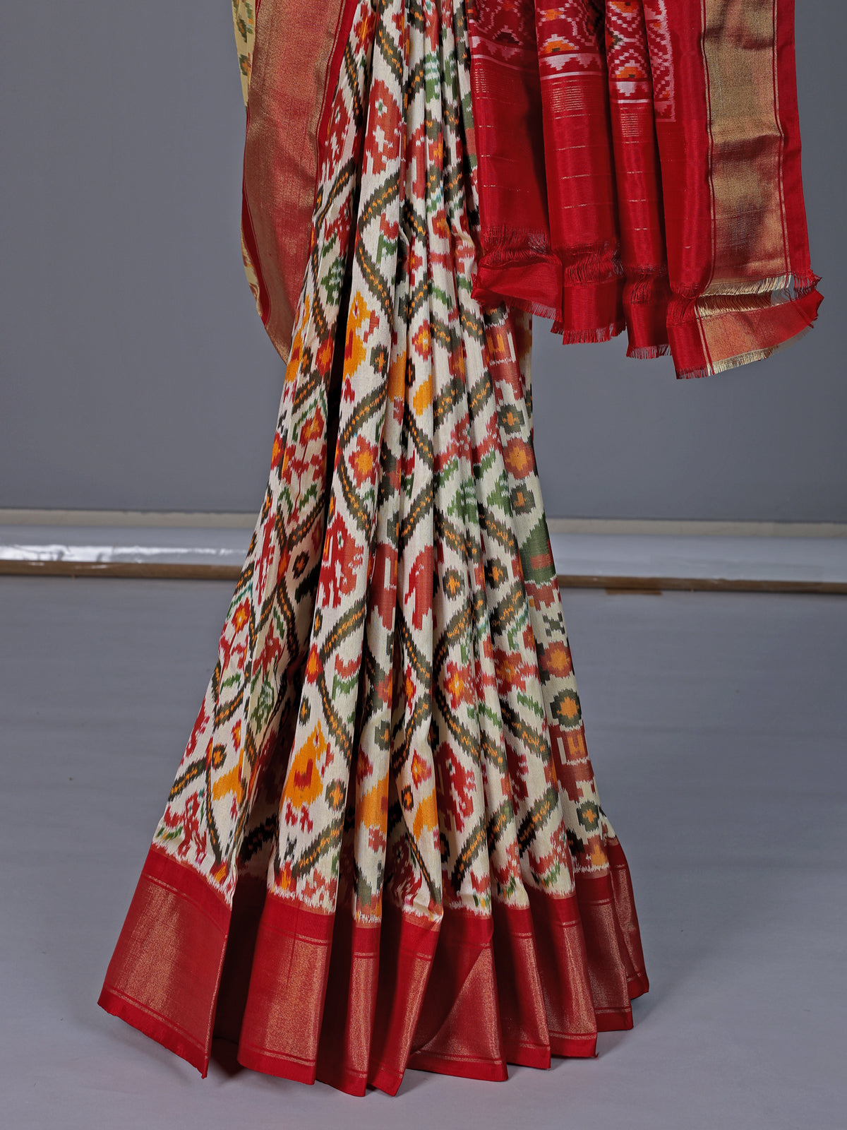 Off white pure hyderabadi patola silk saree with contrast border