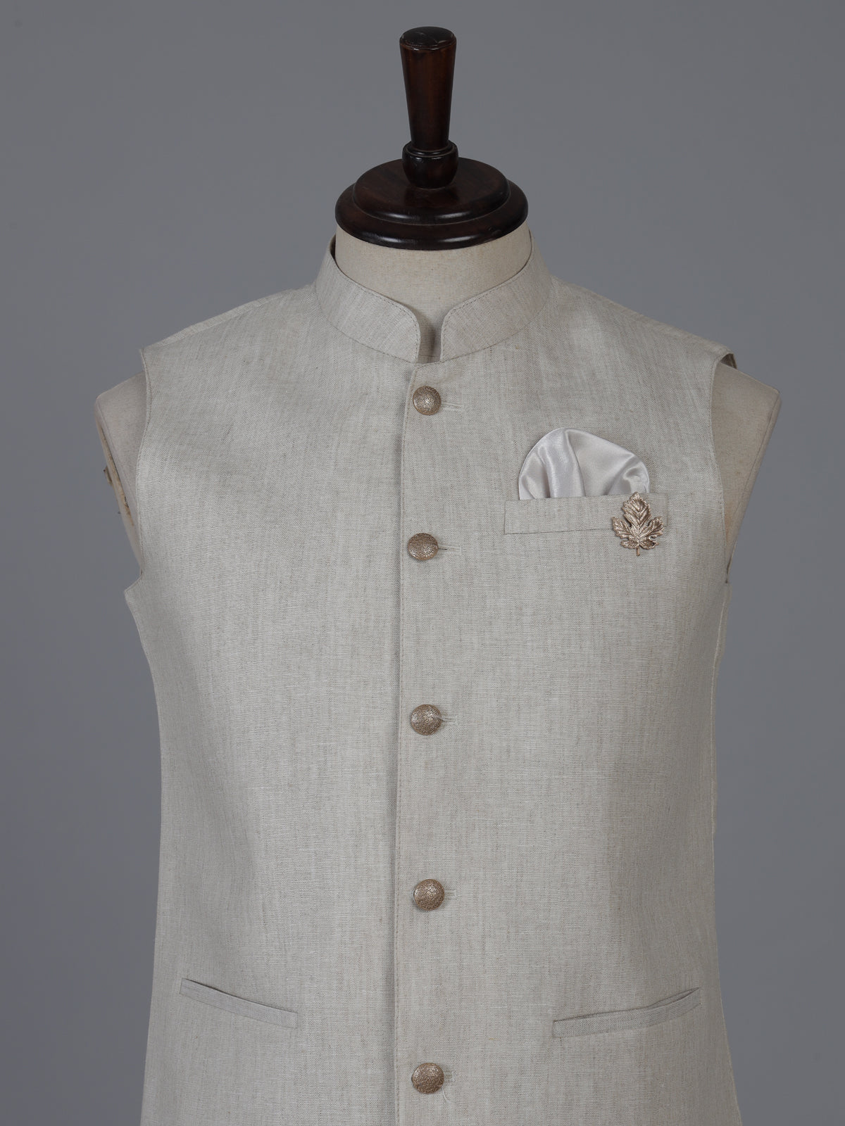 Beige linen waistcoat with brooch detailing