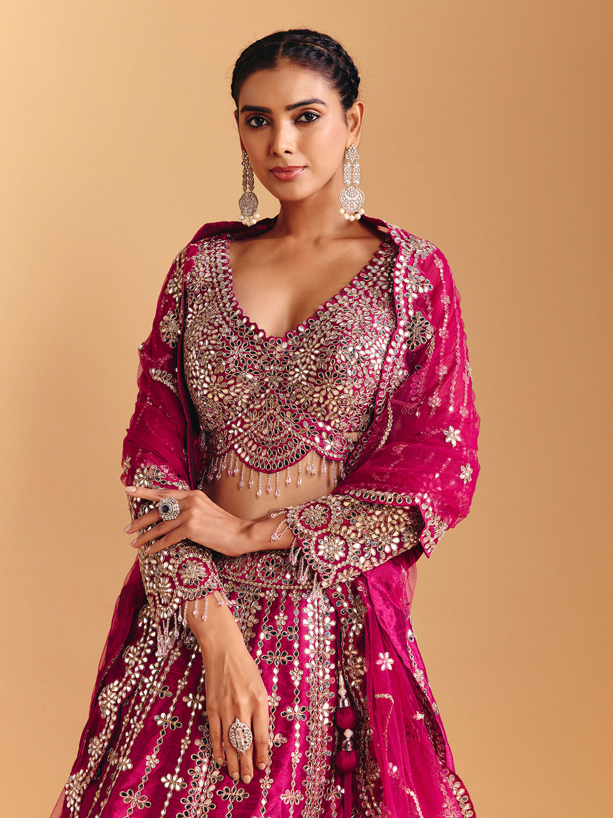Deep rani pink raw silk lehenga choli with mirror embellishments