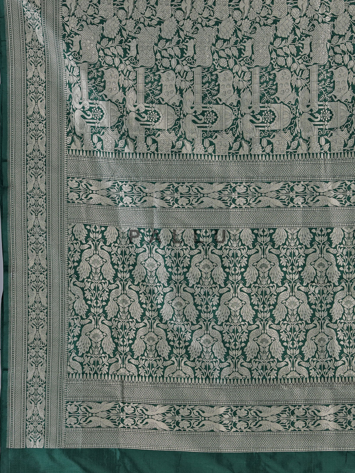 Dark green banarasi silk saree designed for wedding wear