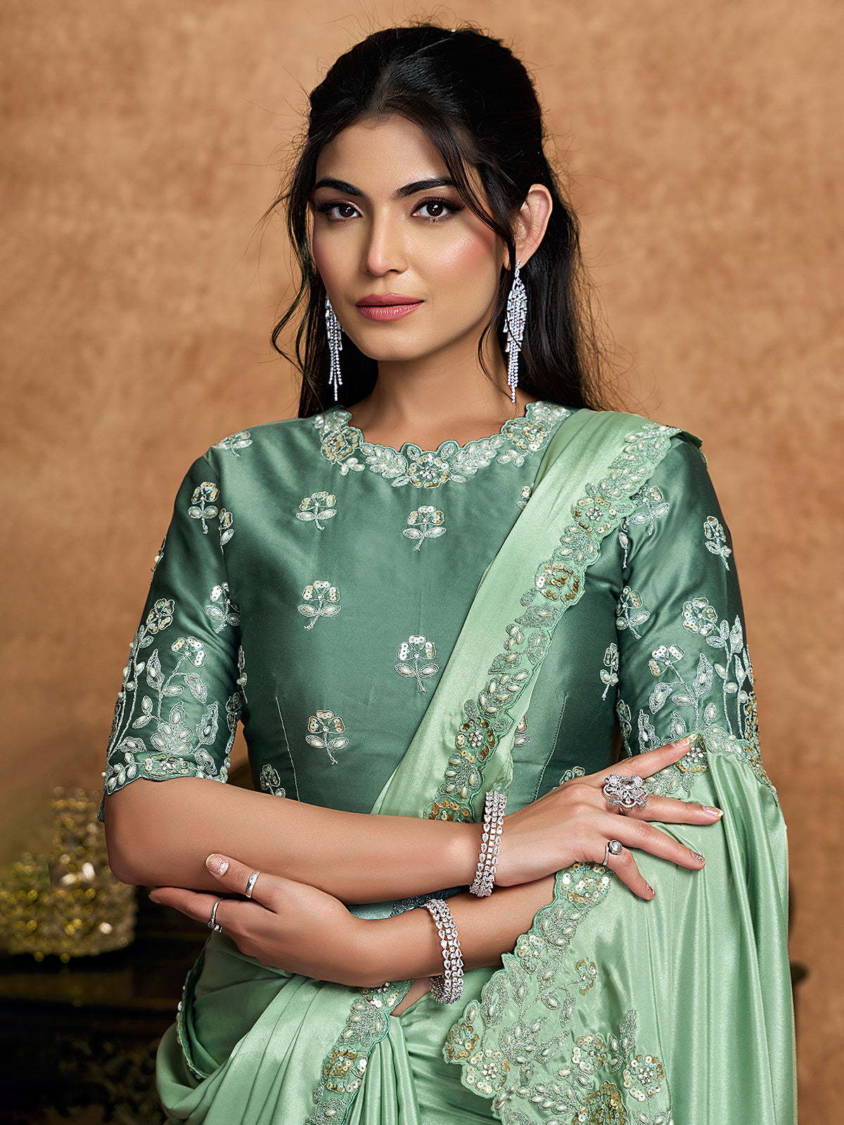 Pista green crepe satin saree with embellished border