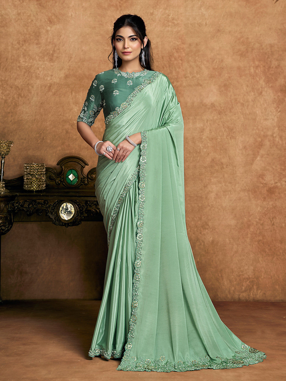Pista green crepe satin saree with embellished border