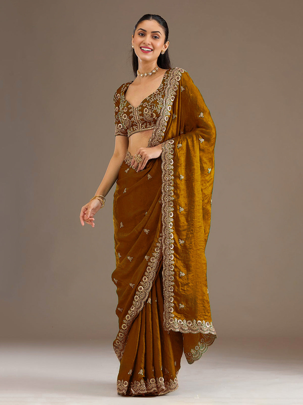 Gold tissue saree with cutdana and sequins work