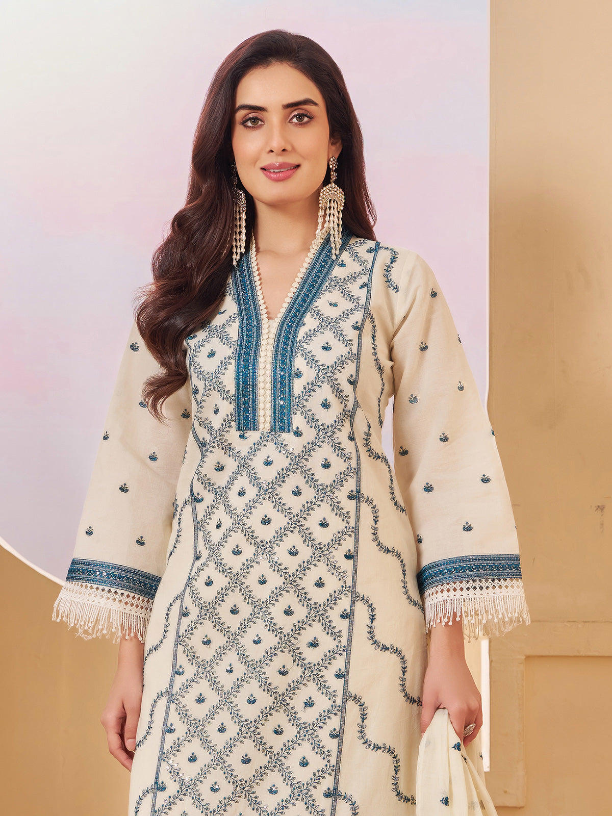 Cream cotton pakistani salwar suit with embroidery detailing