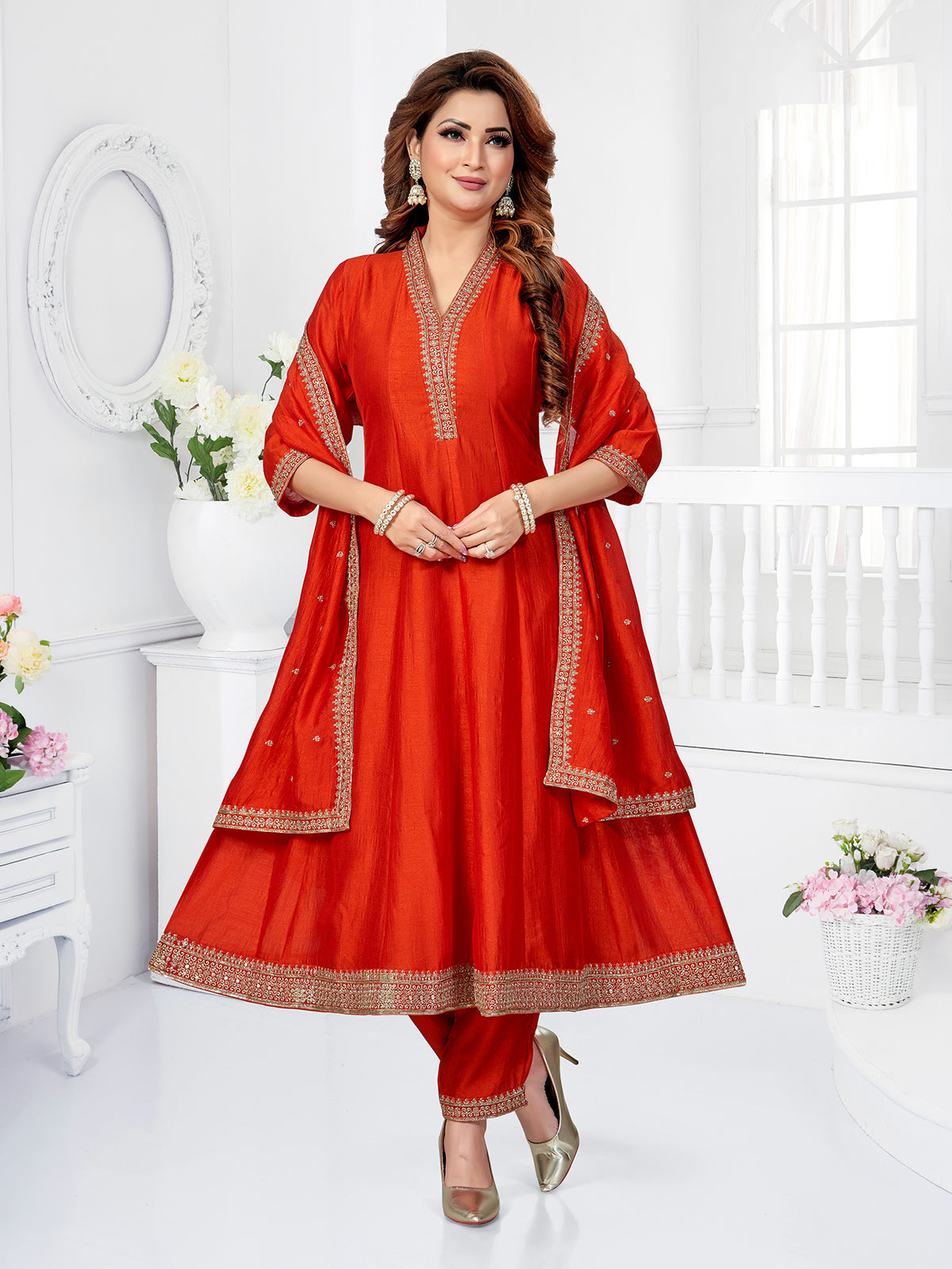 Rust orange silk anarkali suit with festive shimmer