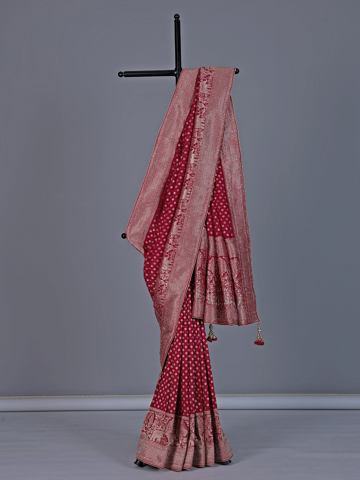 Maroon dola silk saree with elephant motif zari design
