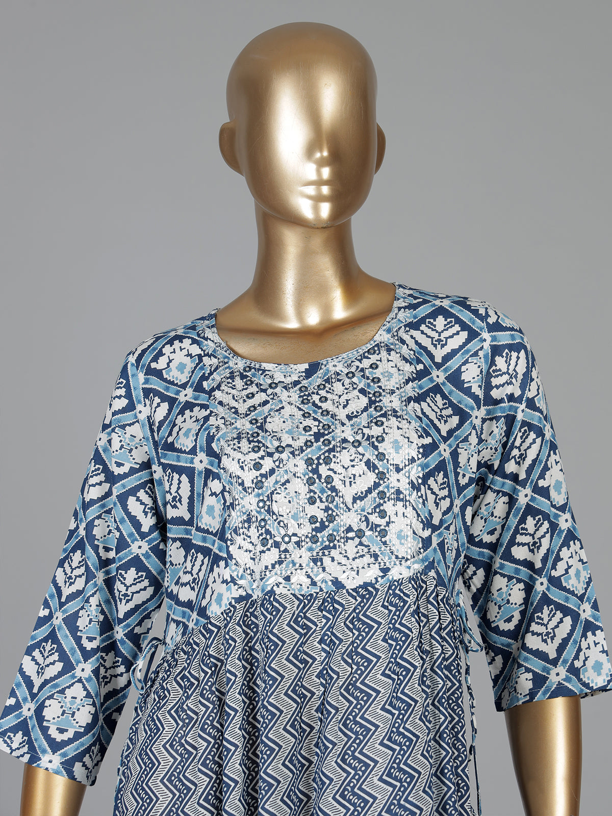 Blue printed cotton kurti designed with worked yoke pattern