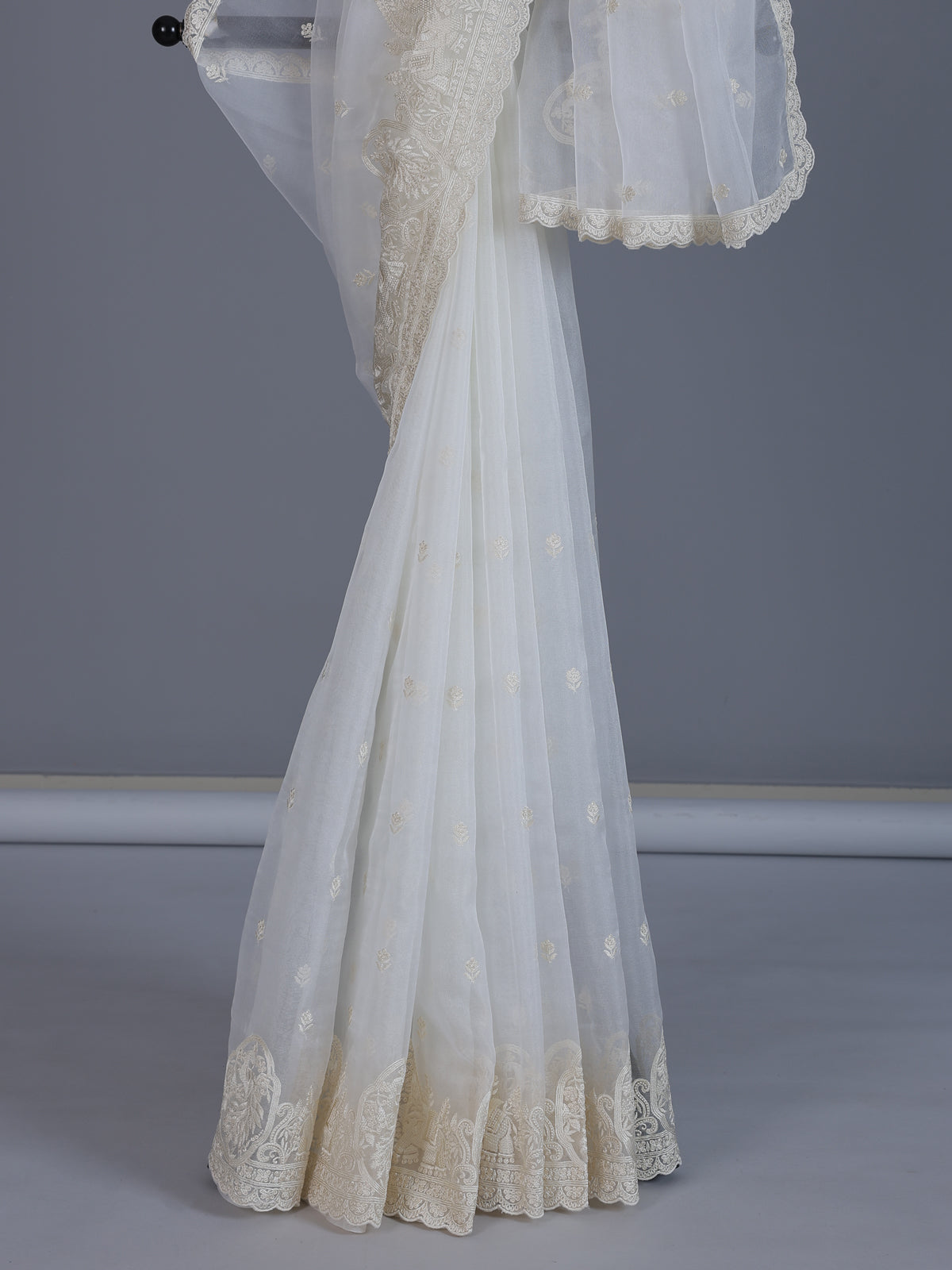 White organza tissue saree with graceful embroidered festive elegance
