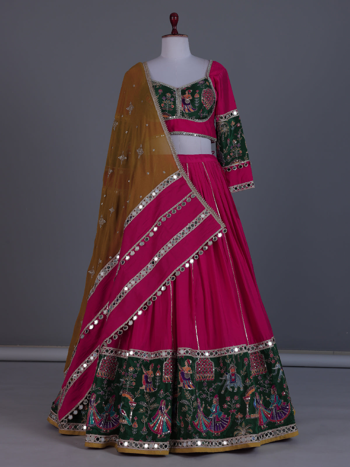 Rani pink mirror adorned festive lehenga grandeur