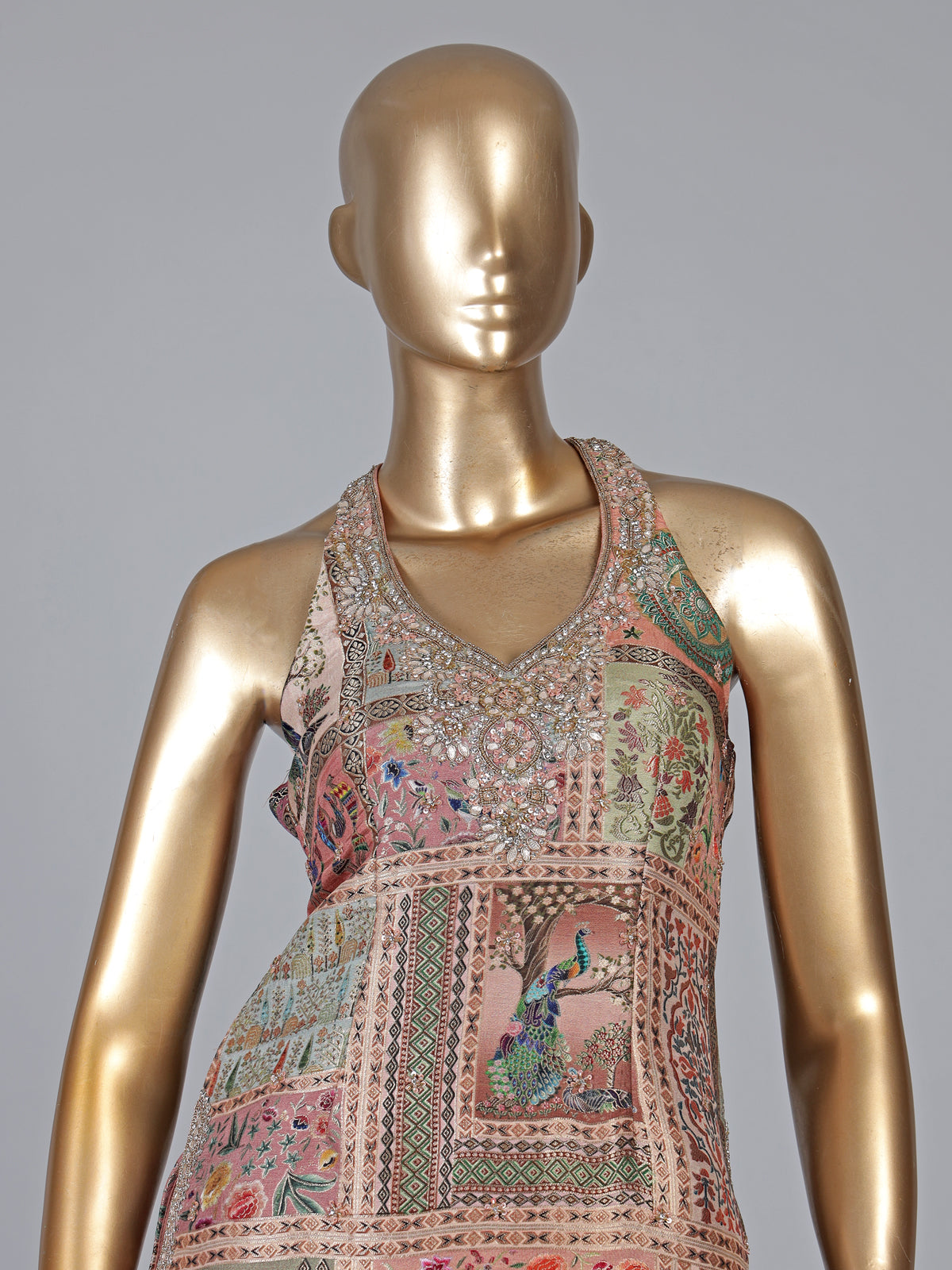 Pastel peach silk sharara suit with rich embellishment