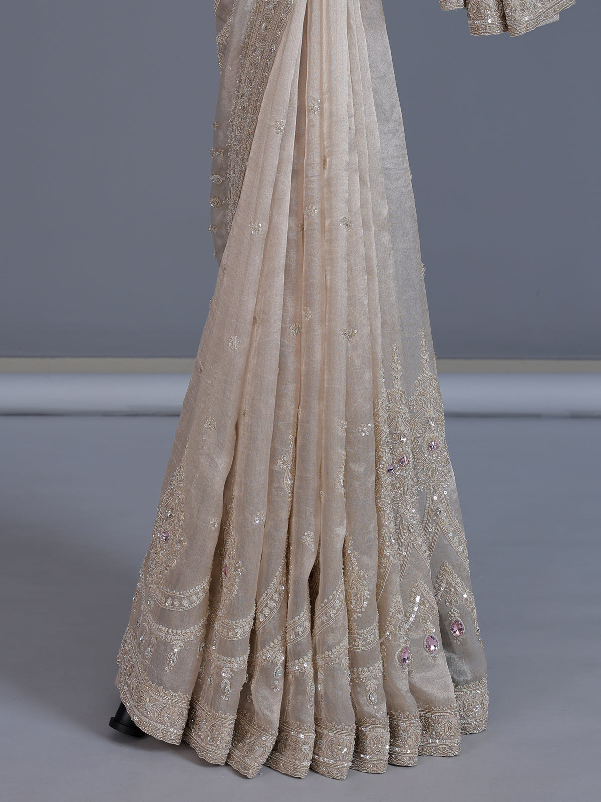 Beige tissue silk reception wear saree with cutdana work