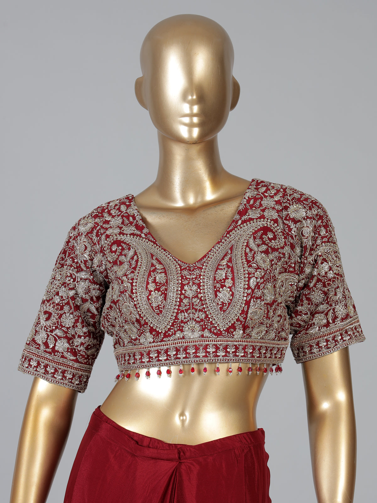 Maroon tissue silk designer saree with elegant embellishments