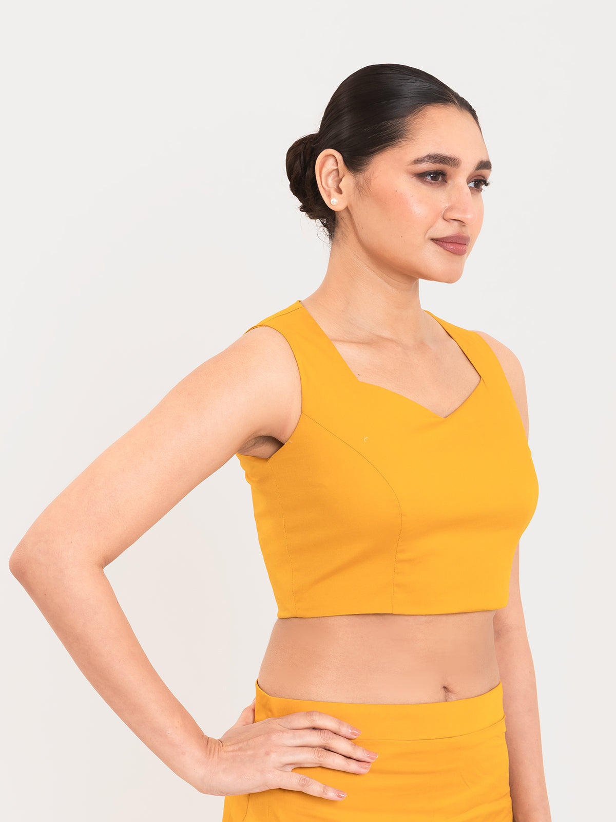Yellow cotton lycra sweetheart neck sleeveless blouse