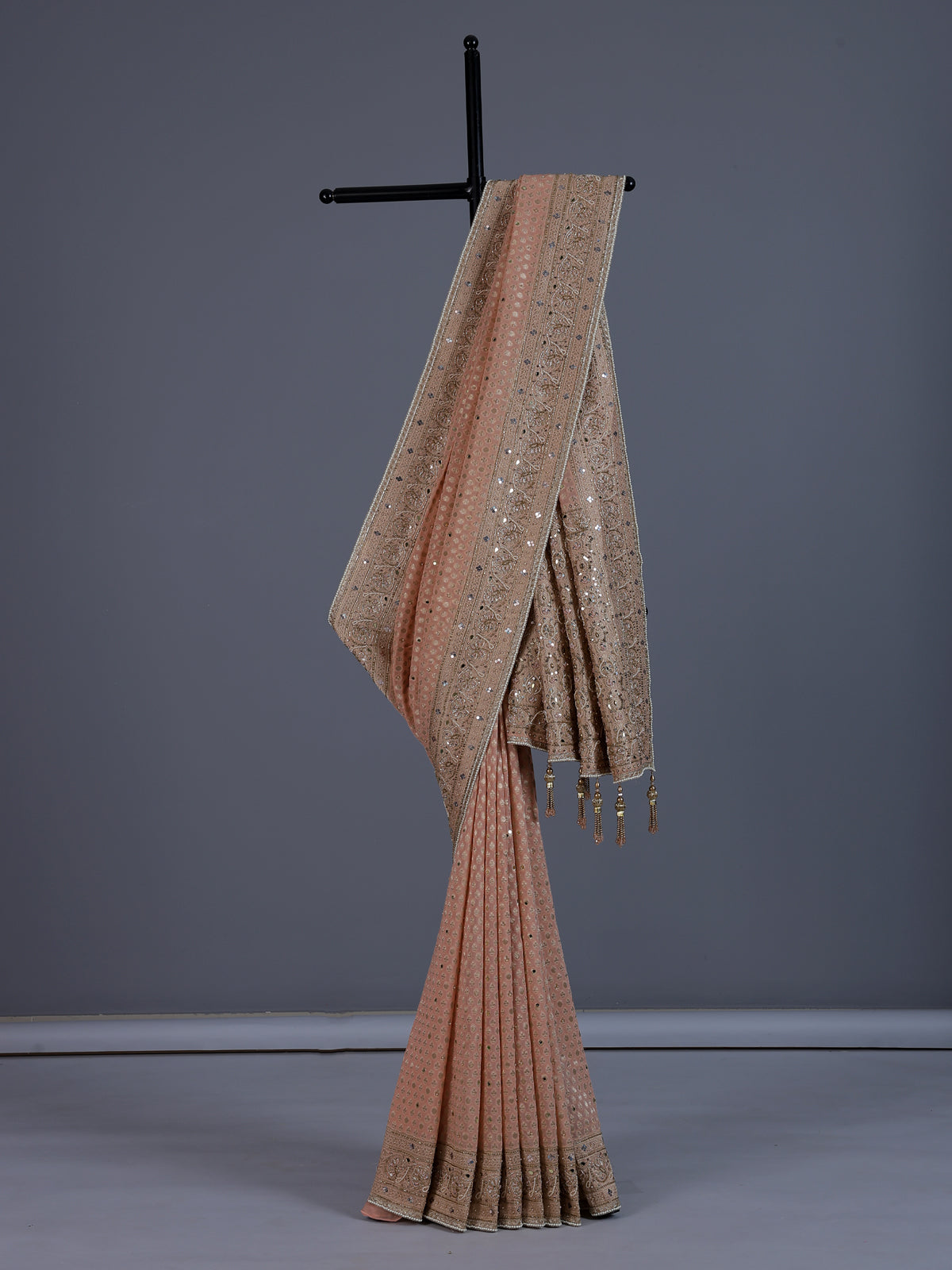 Peach dola silk saree with elegant tassel pallu