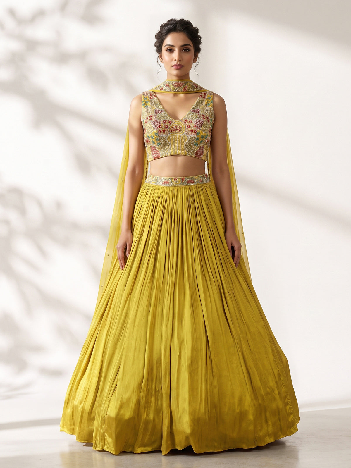 Yellow chinon silk haldi lehenga choli with choker