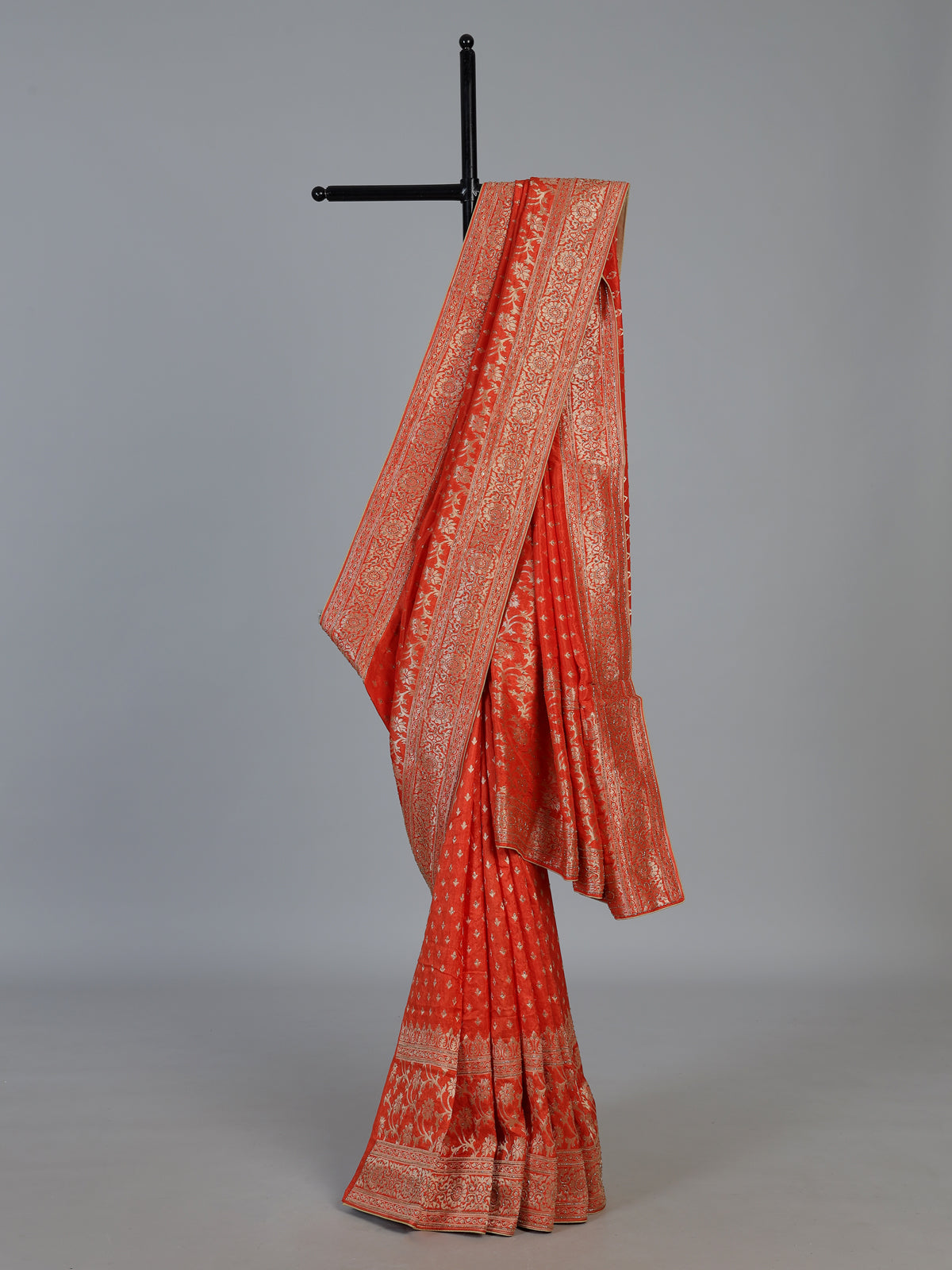 Rust orange premium dola silk saree with elegant zari artistry