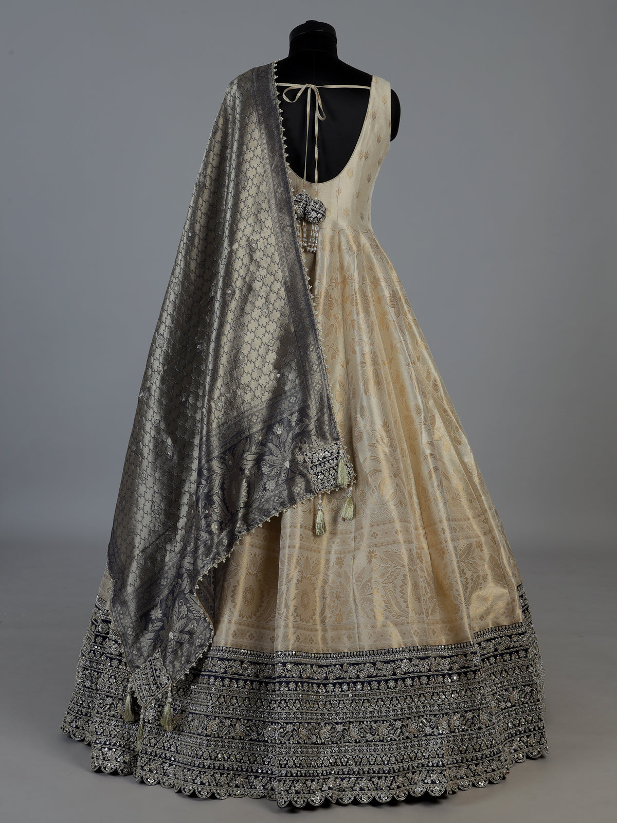 Ivory silk sleeveless anarkali salwar suit with elegant dupatta