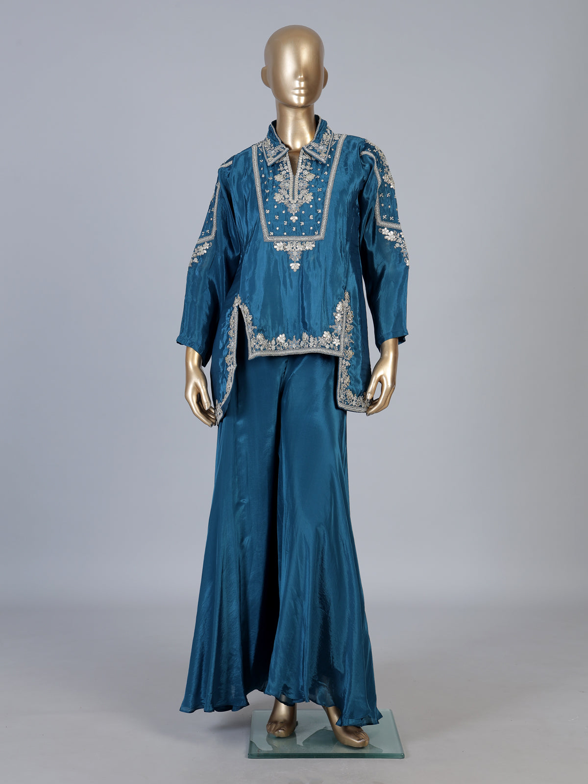 Blue designer silk sharara suit with contemporary asymmetrical style
