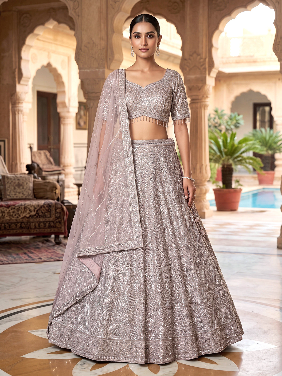 Onion pink embellished net designer lehenga choli