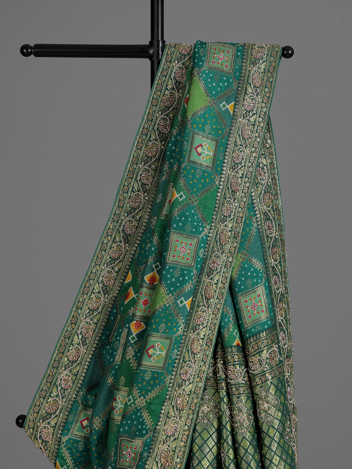 Green bandhej dola silk saree with traditional festive elegance